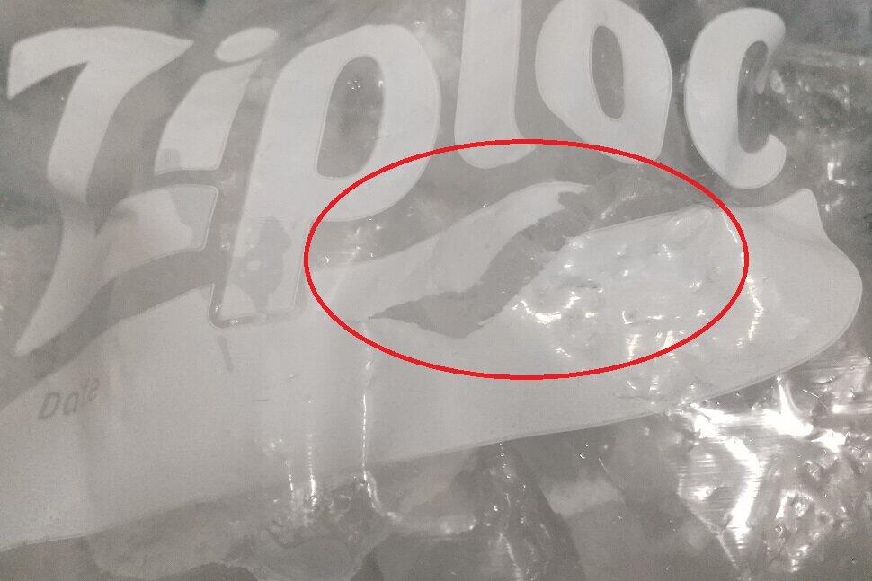 袋が裂けた（赤丸内）