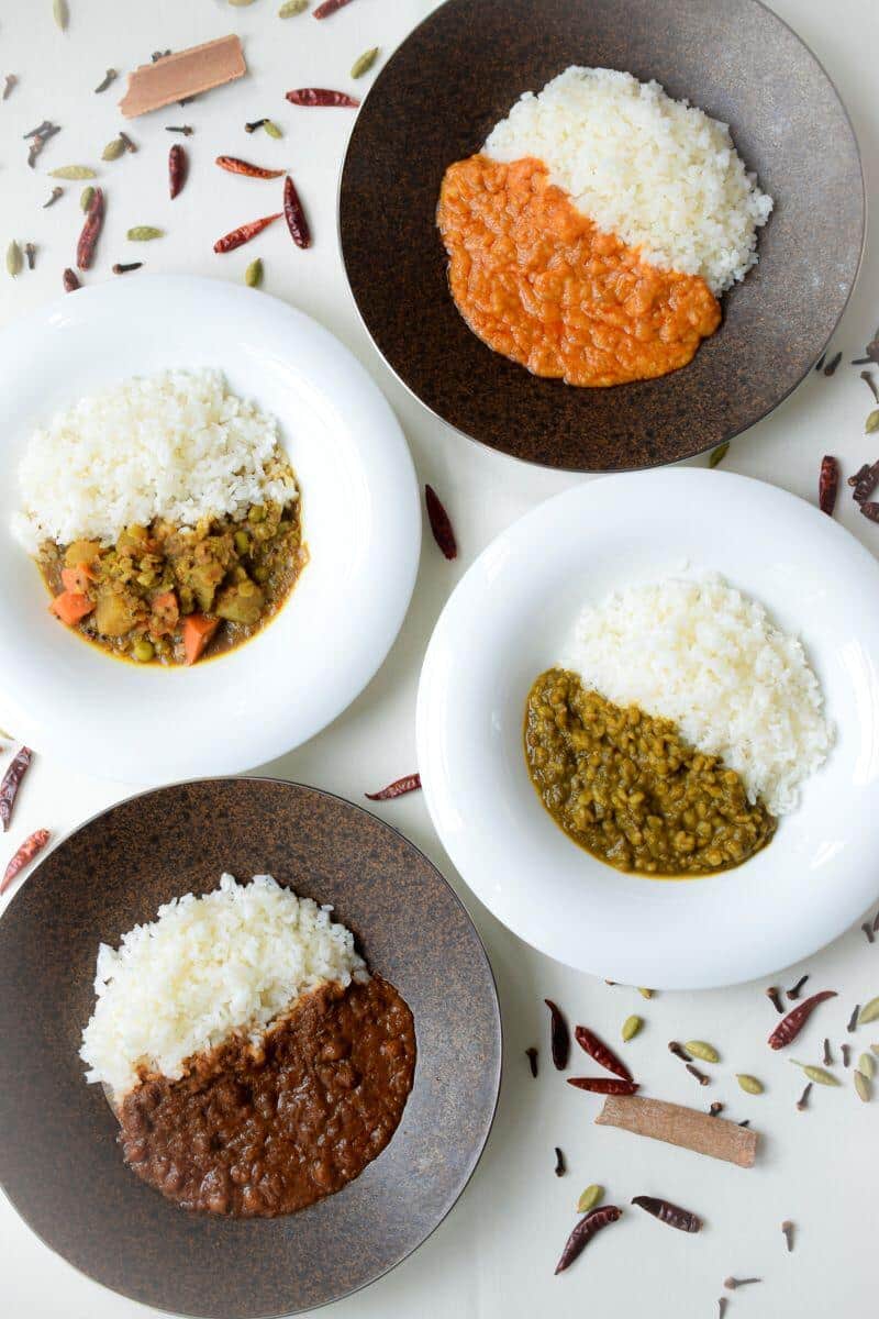 「スズキ食堂インドベジタリアンカレー」全4種の盛り付けイメージ（スズキ提供）