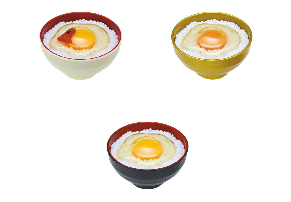 「卵かけご飯」がカプセルトイフィギュアに　黄身を押すとライトが点灯